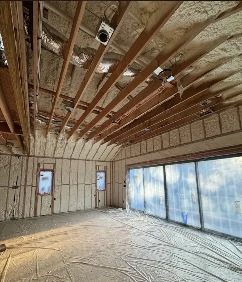 Interior walls and ceiling insulated with spray foam during new construction in Newberry
